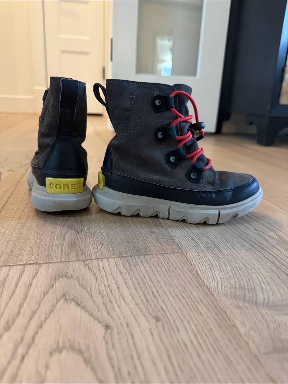 Sorel Kids charcoal grey and Black Boots with Red Laces and Yellow Heel Tab